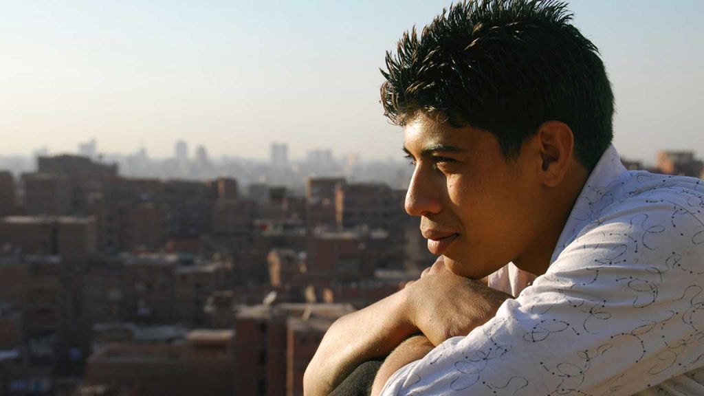 Young man views Cairo skyline.