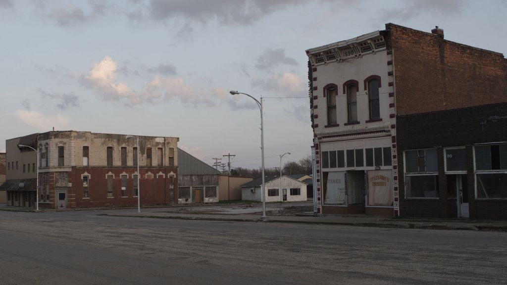 Decaying buildings face an empty street in small town Rich Hill