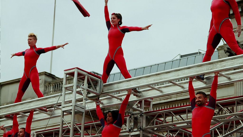 STREP extreme action dancers prepare to dive off the Millennium Bridge in London.