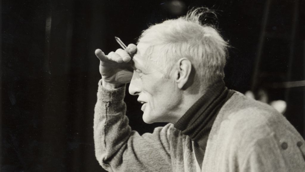 A profile shot of Albert Cullum facing and looking left, with a pencil in his hand