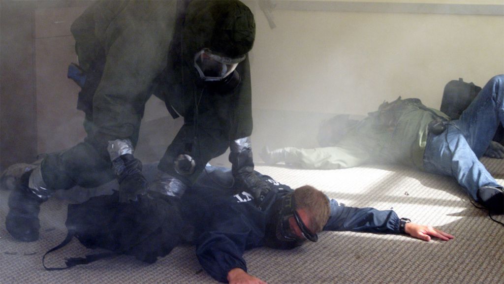 An agent holds down a terror suspect in a government counterterror training exercise.