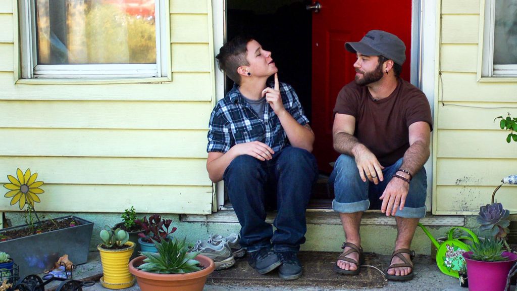 Bennett and Joe from Real Boy, sitting on steps in front of Joe's house comparing chin hairs