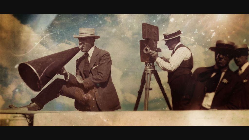 Still from Birth of a Movement, of DW Griffith on set directing a film with megaphone