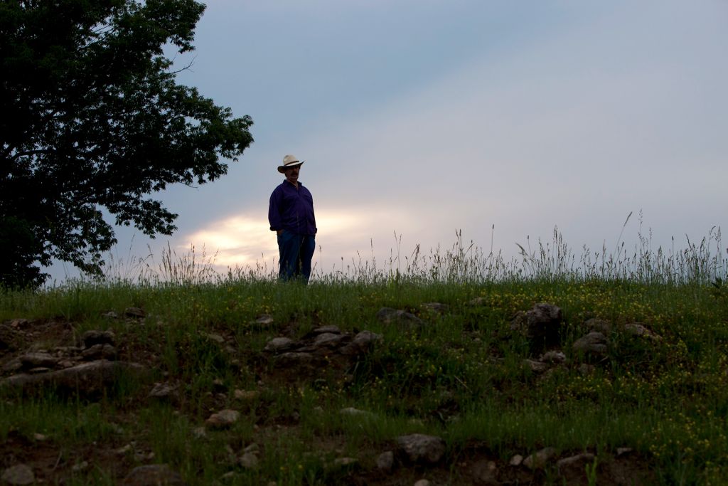 Rick Hall stands on a hillside in Muscle Shoals.