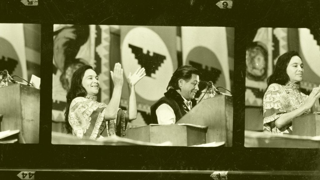 Dolores Huerta, with Cesar Chavez, in public speech from the 60s, in a film strip image