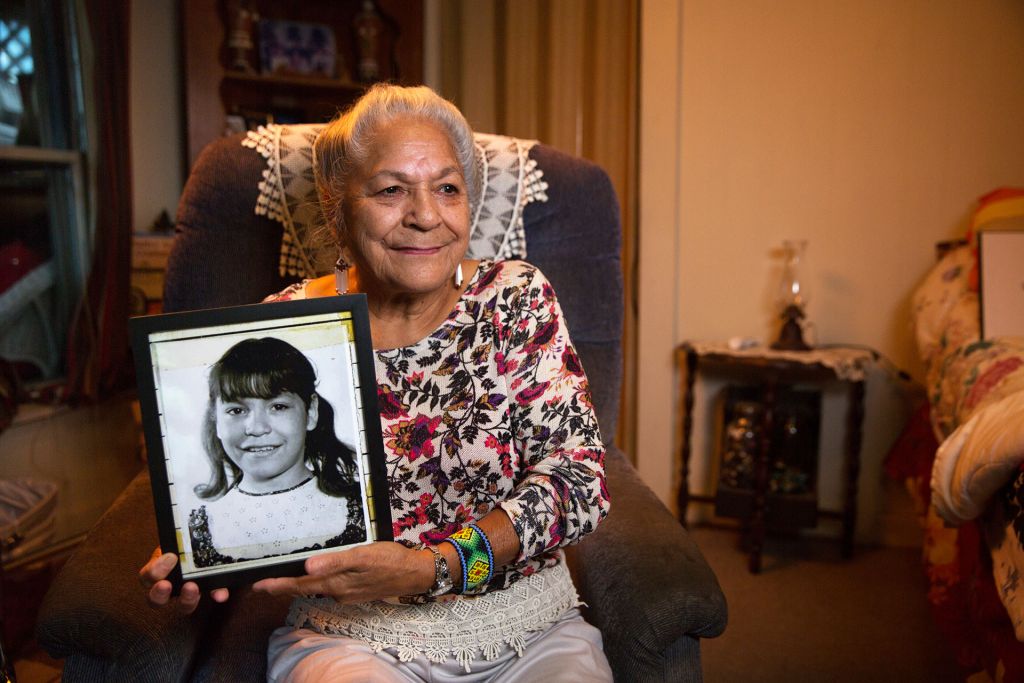 Georgina Sappier-Richardson (Passamaquoddy) holding her childhood photo; from Dawnland