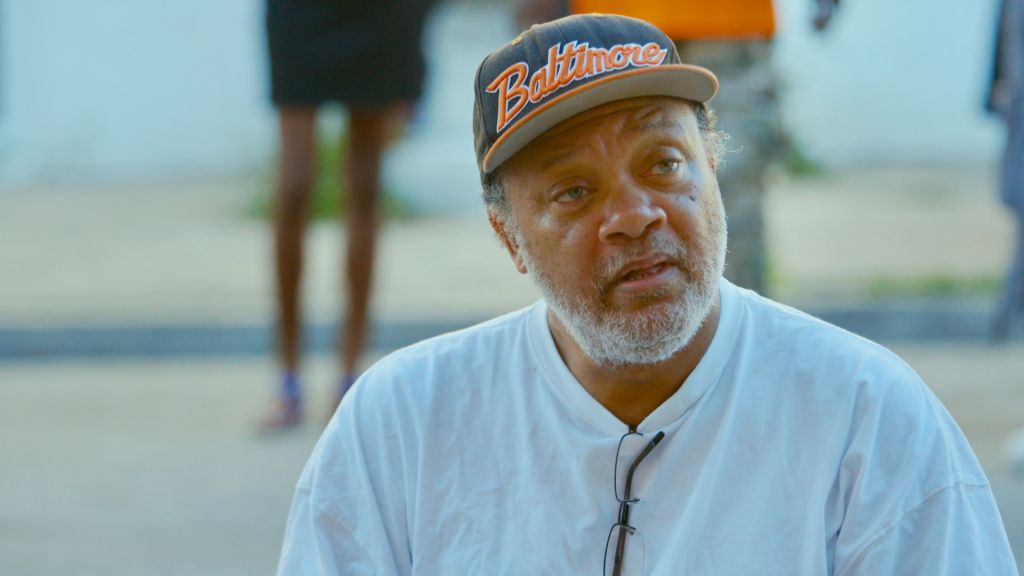 Mr. C from Charm City, sporting a Baltimore hat