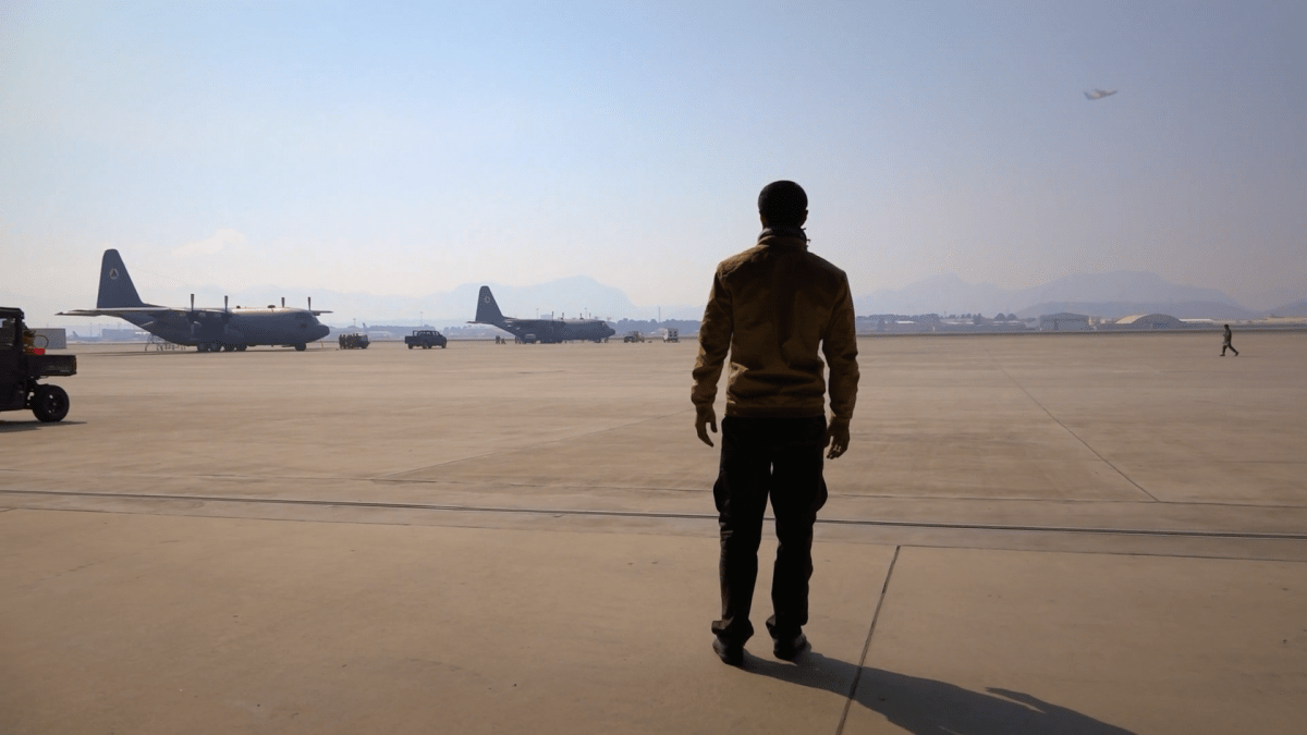 Interpreter stands at US Military base, from the film The Interpreters