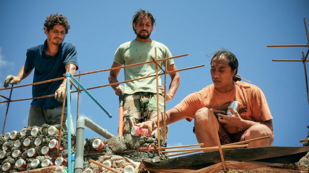 Enrique and members of Toki Music School building with recyclable materials. From Eating Up Easter.