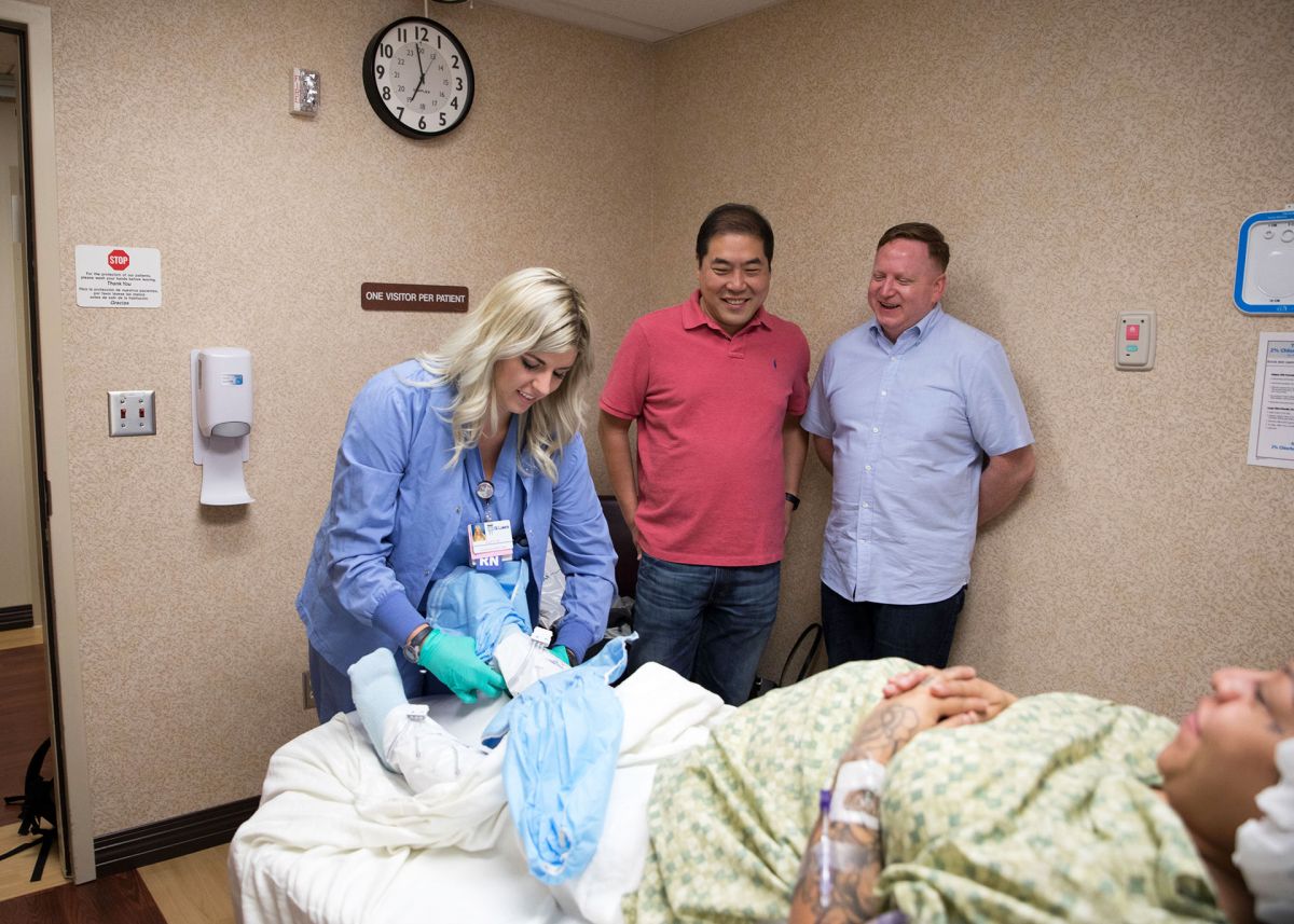 Sammy, David, and Todd as the nurse preps for delivery, in Made in Boise.