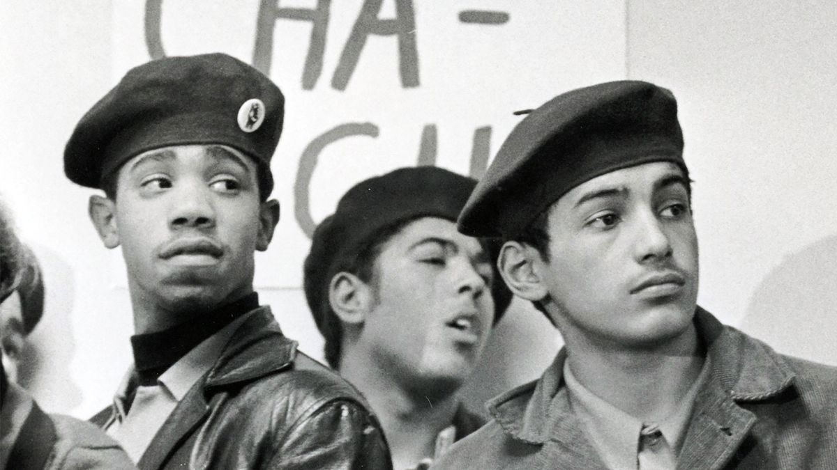 Black and white photograph of three young people in berets as part of a Rainbow Coalition.