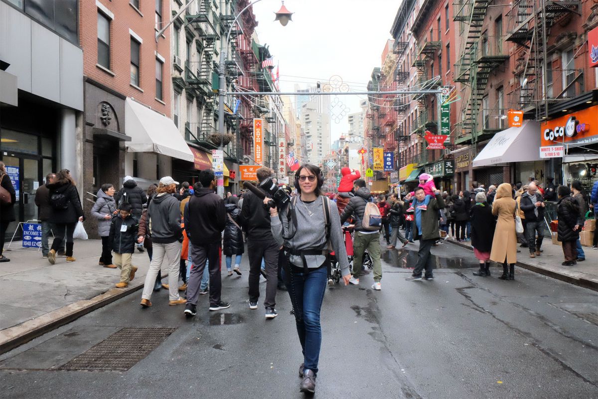 Filmmaker Ursula Liang with camera on location in New York