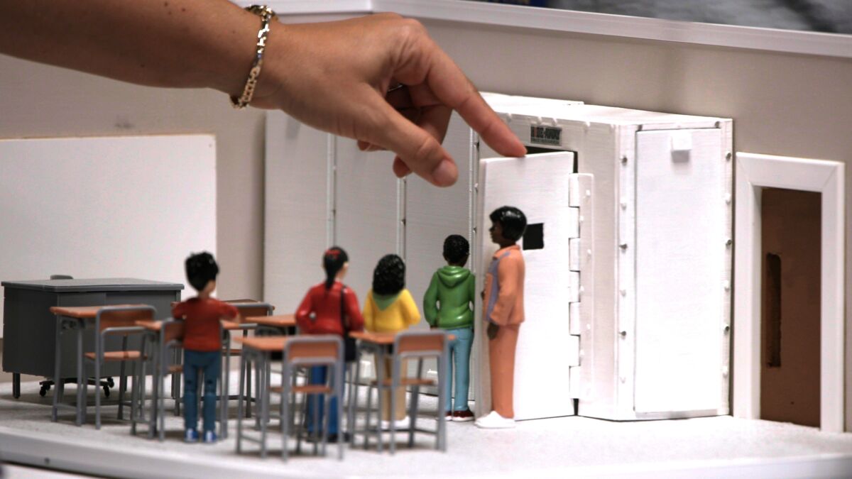 Children Figurines and teacher in classroom headed to panic room