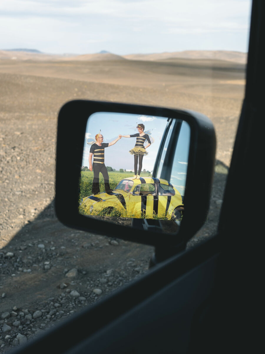 Side mirror with image from Real Dirt on Farmer John in the mirror