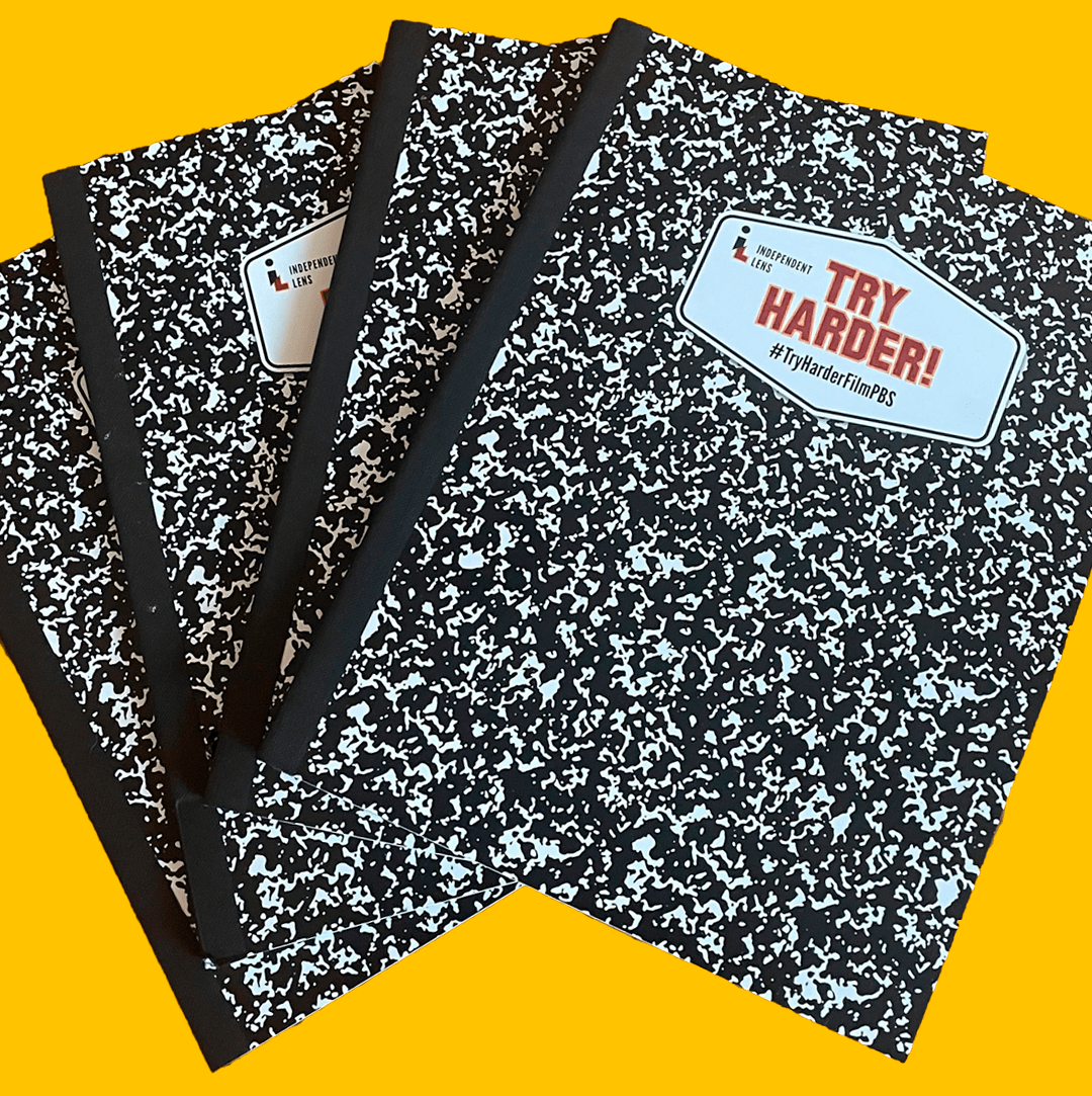 Four black and white marbled composition notebook emblazoned with the phrase "Try Harder!" set against a yellow background.