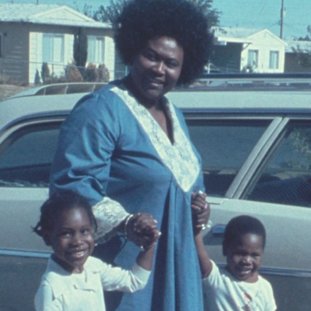 Film photograph of Ruby Duncan, Black welfare activist, and her two children.