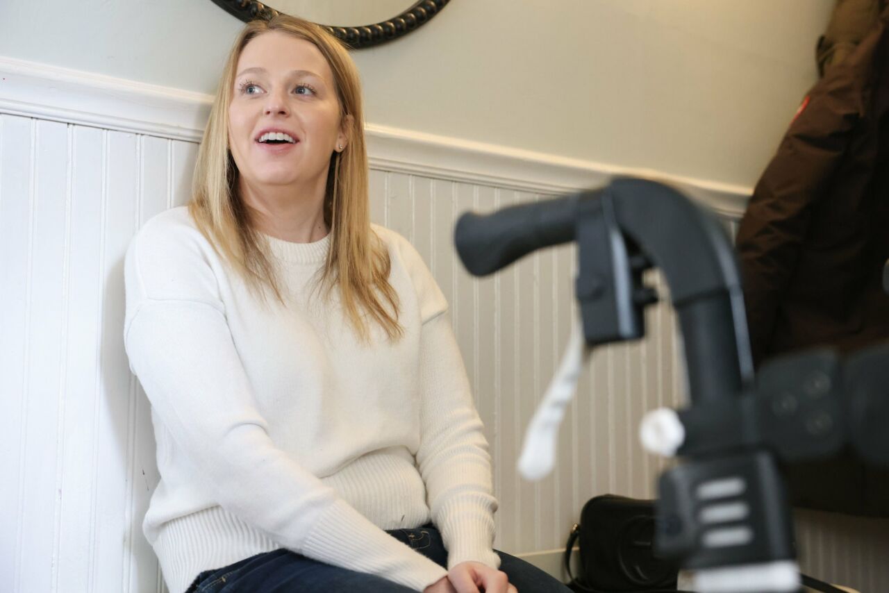 Michele Stellato sits in front of her walker