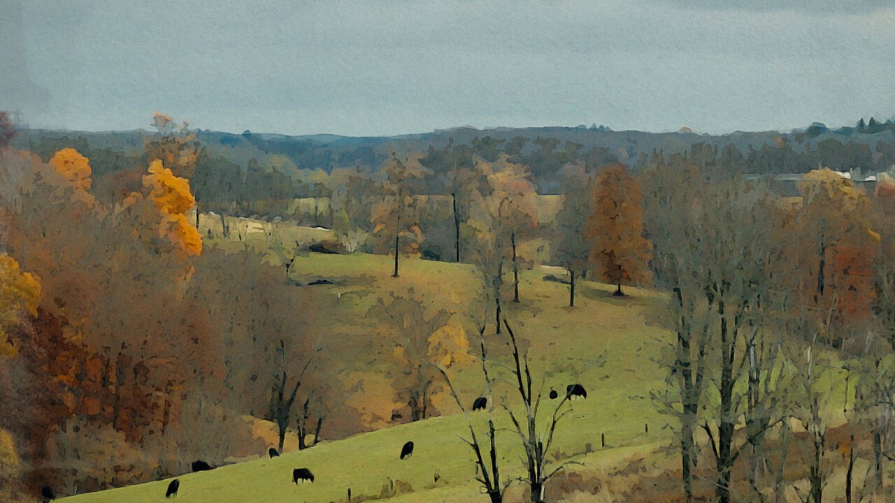 Painting of green field with trees in fall colors and farm animals