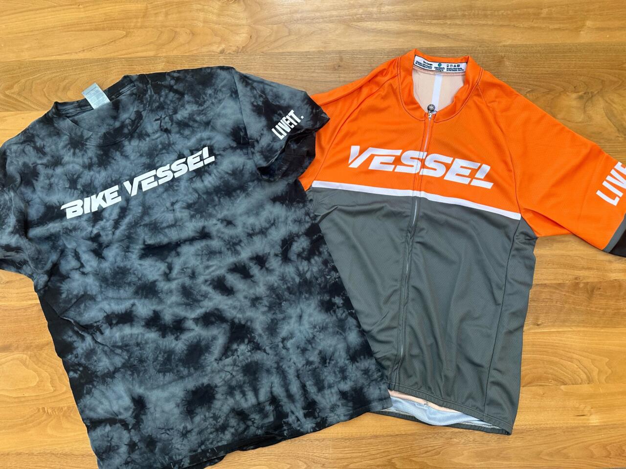 Bike Vessel grey and black shirt and orange and gray cycling jersey