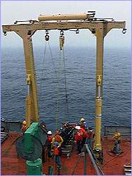 Seamen and scientists alike gather around the chimney.