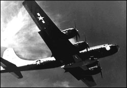 The B-29 in flight, with the X-1 slung beneath it.