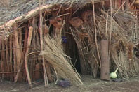 Mud-floored thatch hut