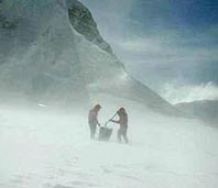 Climbers in blowing snow