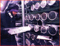 Researcher removing ice core from storage