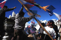 sherpas raising prayer flags