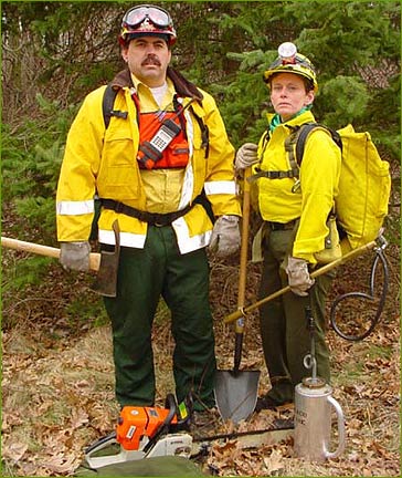 Three firefighers with equipment