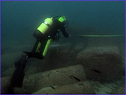 Diver mapping underwater feature