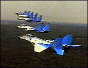 fighters flying in formation